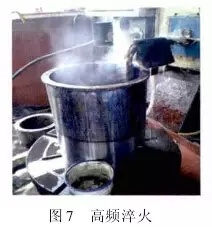 1 引言  山東魯碧建材有限公司2號(hào)輥磨為德國(guó)進(jìn)口萊歇磨，主要用于生產(chǎn)礦渣微粉，減速機(jī)采用弗蘭德品牌，型號(hào)為：KMPP651，其結(jié)構(gòu)為一級(jí)傘齒加兩級(jí)行星傳動(dòng)。2013年3月9日，該減速機(jī)因功率過(guò)高報(bào)警，而且潤(rùn)滑系統(tǒng)回油溫度急劇升高，晚上23：25減速機(jī)潤(rùn)滑站過(guò)濾器壓差高報(bào)警，整個(gè)系統(tǒng)跳停。檢查過(guò)濾器濾網(wǎng)時(shí)發(fā)現(xiàn)有大量的黃色銅屑，經(jīng)化驗(yàn)銅屑成分為CuAl10Ni查閱設(shè)備圖紙推測(cè)該合金來(lái)自二級(jí)行星輪中的銅瓦。經(jīng)過(guò)咨詢(xún)，弗蘭德專(zhuān)家給出了同樣的判斷，并提供了具體的解決方案。隨后， 山東魯碧建材有限公司按照弗蘭德公司出具的方案對(duì)該減速機(jī)進(jìn)行了搶修。目前該減速機(jī)運(yùn)行接近兩個(gè)月且效果良好?，F(xiàn)將具體原因、修復(fù)方案及預(yù)防措施簡(jiǎn)單描述。  2 原因分析  該減速機(jī)自2008年2月份開(kāi)始使用，到現(xiàn)在已運(yùn)轉(zhuǎn)5年多，運(yùn)轉(zhuǎn)率接近90%，因此設(shè)備或多或少存在老化問(wèn)題，尤其是里面的合金瓦，由于自身硬度較低，一旦潤(rùn)滑不良很容易造成損傷。在拆檢減速機(jī)時(shí)發(fā)現(xiàn)二級(jí)行星有一個(gè)行星輪堆積了大量的合金，且無(wú)法轉(zhuǎn)動(dòng)，證明我們的判斷正確。在對(duì)該行星輪拆檢中發(fā)現(xiàn)了以下三個(gè)問(wèn)題：（1）兩側(cè)的推力瓦嚴(yán)重?zé)g熔化（圖1）；（2）銅瓦處存積了大量油泥并將潤(rùn)滑油道堵塞，而且銅瓦整個(gè)開(kāi)裂、軸向延展接近30mm（圖2）；（3）銷(xiāo)軸局部裂紋（圖3）。    根據(jù)以上損壞分析，銅瓦潤(rùn)滑油孔堵塞之后，造成銅瓦急劇升溫，溫度升高到一定程度使得銅瓦受熱開(kāi)裂并且膨脹延展，最終與兩側(cè)的推力瓦接觸，推力瓦受到擠壓以后迅速升溫最終燒蝕，銷(xiāo)軸因此承受較大的扭矩及高溫，造成裂紋。  3 處理方案  推力瓦、銅瓦、銷(xiāo)軸的方案為按照尺寸重新制作備件。但在檢測(cè)齒輪時(shí)發(fā)現(xiàn)其內(nèi)孔圓柱度較差以至于變成橢圓，而且表面硬度下降，遠(yuǎn)遠(yuǎn)低于圖紙要求（HRC55+5）。我們聯(lián)系弗蘭德公司欲購(gòu)買(mǎi)該齒輪，對(duì)方回復(fù)該齒輪需要德國(guó)進(jìn)口，加工周期為6個(gè)月，而且為保證齒輪嚙合，建議6個(gè)齒輪一起更換。此時(shí)， 山東魯碧建材有限公司銷(xiāo)售正處于旺季，該輥磨每天生產(chǎn)3000t微粉，停機(jī)6個(gè)月對(duì)我們的損失可想而知。我們聯(lián)系弗蘭德總部專(zhuān)家要求給出整改方案。對(duì)方經(jīng)過(guò)詳細(xì)計(jì)算給出如下方案：擴(kuò)大齒輪內(nèi)孔直徑，再加一個(gè)過(guò)渡套，從而保證齒輪的硬度及裝配要求（圖5）。    3.1 過(guò)渡套材料選擇 過(guò)渡套材料采用42CrMo。該材料強(qiáng)度、淬透性高，韌性好，淬火時(shí)變形小，高溫時(shí)有高的蠕變強(qiáng)度和持久強(qiáng)度，用于制造要求強(qiáng)度更高和調(diào)質(zhì)截面更大的鍛件。  3.2 處理工藝    （1）鍛打：目的是減小殘留夾雜物的尺寸，使其成分趨于均勻，組織趨于致密，細(xì)化晶粒，改善鋼的性能。    （2）粗車(chē)：?jiǎn)芜吜?mm加工余量。    （3）著色探傷：目的是檢查工件是否有損傷，從而保證下一道工序順利進(jìn)行。    （4）完全退火：目的是使工件的內(nèi)部組織全部進(jìn)行重結(jié)晶，通過(guò)完全退火來(lái)細(xì)化晶粒，均勻組織，消除內(nèi)應(yīng)力，同時(shí)降低硬度，便于切削加工，并為加工后零件的淬火作好組織準(zhǔn)備（圖6）。    具體過(guò)程：零件在爐溫>800℃裝爐，立即通入甲醇：50~60ml/min、氮?dú)猓?~6m3/h；溫度升到850℃之后甲醇：35~45ml/min、氮?dú)猓?m3/h；保溫120min后隨爐冷降溫至650℃，停甲醇，氮?dú)猓?m3/h；降溫至550℃時(shí)出爐空冷。    （5）半精車(chē)：?jiǎn)芜?.75mm，從而滿(mǎn)足下一步淬火的淬硬層>0.5mm的要求。    （6）高頻淬火（圖7）：該套由于工作面是套的內(nèi)孔及兩個(gè)端面，硬度要求HRC58-62，淬硬層>0.5mm。因此，選擇高頻淬火，這樣既能局部熱處理，同時(shí)也滿(mǎn)足硬度要求。另外，高頻淬火時(shí)工件的冷卻至關(guān)重要，為保險(xiǎn)起見(jiàn)采用淬火液進(jìn)行冷卻；感應(yīng)器距離工件的位置也非常重要，離得太近容易造成感應(yīng)器受熱，堵塞冷卻水溢流孔，離得太遠(yuǎn)影響熱功率的傳遞，一般控制在3~5mm。       （7）精車(chē)外圓及內(nèi)孔：外圓最終尺寸為?330t6，內(nèi)孔最終尺寸為?330H6，這樣保證外圓與齒輪內(nèi)孔過(guò)盈配合，過(guò)盈量控制在0.2~0.3mm；內(nèi)孔與銅套間隙配合，間隙控制在0.1~0.12mm。    （8）精車(chē)端面：將過(guò)渡套與齒輪進(jìn)行冷裝之后，對(duì)過(guò)渡套的端面進(jìn)行精車(chē)，要求兩個(gè)端面與內(nèi)孔垂直度，圓跳度誤差控制在0.02mm以?xún)?nèi)。 目前，該減速機(jī)已恢復(fù)生產(chǎn)兩個(gè)月，二級(jí)行星振動(dòng)值3~5mm/s，輥壓9.0MPa，比表面積440m2/kg，磨機(jī)產(chǎn)量也逐漸恢復(fù)到150t/h，運(yùn)轉(zhuǎn)狀況良好。  4 采取的措施  4.1 加強(qiáng)設(shè)備巡檢并采用先進(jìn)的檢測(cè)工具 該減速機(jī)恢復(fù)生產(chǎn)之后，我們加強(qiáng)了巡檢力度，購(gòu)買(mǎi)了先進(jìn)的在線(xiàn)巡檢儀，它不僅能對(duì)減速機(jī)振動(dòng)進(jìn)行檢測(cè)形成趨勢(shì)圖，而且還能進(jìn)行數(shù)據(jù)傳輸及保存，這樣我們就能夠通過(guò)趨勢(shì)圖來(lái)推斷減速機(jī)運(yùn)行狀況。  4.2 加強(qiáng)油品檢測(cè) 目前，我們每個(gè)月都要對(duì)潤(rùn)滑油進(jìn)行檢測(cè)，項(xiàng)目有粘度、機(jī)械雜質(zhì)、水分、污染等級(jí)等，通過(guò)對(duì)油樣的檢測(cè)，可以隨時(shí)掌握減速機(jī)內(nèi)部運(yùn)轉(zhuǎn)狀況，保證了潤(rùn)滑的可靠性。  4.3 提高磨機(jī)操作水平 喂料粒度控制在80mm以?xún)?nèi)，這樣既能保證碾磨料層厚度避免磨機(jī)振動(dòng)，又能提高研磨效率；另外，加強(qiáng)選粉機(jī)轉(zhuǎn)速、喂料量、熱風(fēng)控制的調(diào)整，從而保證磨機(jī)穩(wěn)定順行。  4.4 選用材質(zhì)較好的濾芯 弗蘭德KMPP651減速機(jī)內(nèi)部全部為滑動(dòng)軸承，對(duì)潤(rùn)滑油的潔凈度要求比較高，一旦有異物進(jìn)入很容易造成油道堵塞。因此，濾芯的選用至關(guān)重要，我們現(xiàn)在選用的是力士樂(lè)25μm濾芯，使用效果很好。  5 結(jié)語(yǔ)  輥磨的穩(wěn)定運(yùn)行對(duì)減速機(jī)的使用壽命至關(guān)重要，減少輥磨運(yùn)行的振動(dòng)值，有利于減速機(jī)提高使用壽命；另外，定期檢測(cè)減速機(jī)各個(gè)軸瓦部位的振動(dòng)，并且定期對(duì)潤(rùn)滑油進(jìn)行檢測(cè)及檢查過(guò)濾網(wǎng)上有無(wú)雜質(zhì)，對(duì)提高減速機(jī)的穩(wěn)定順行也至關(guān)重要。